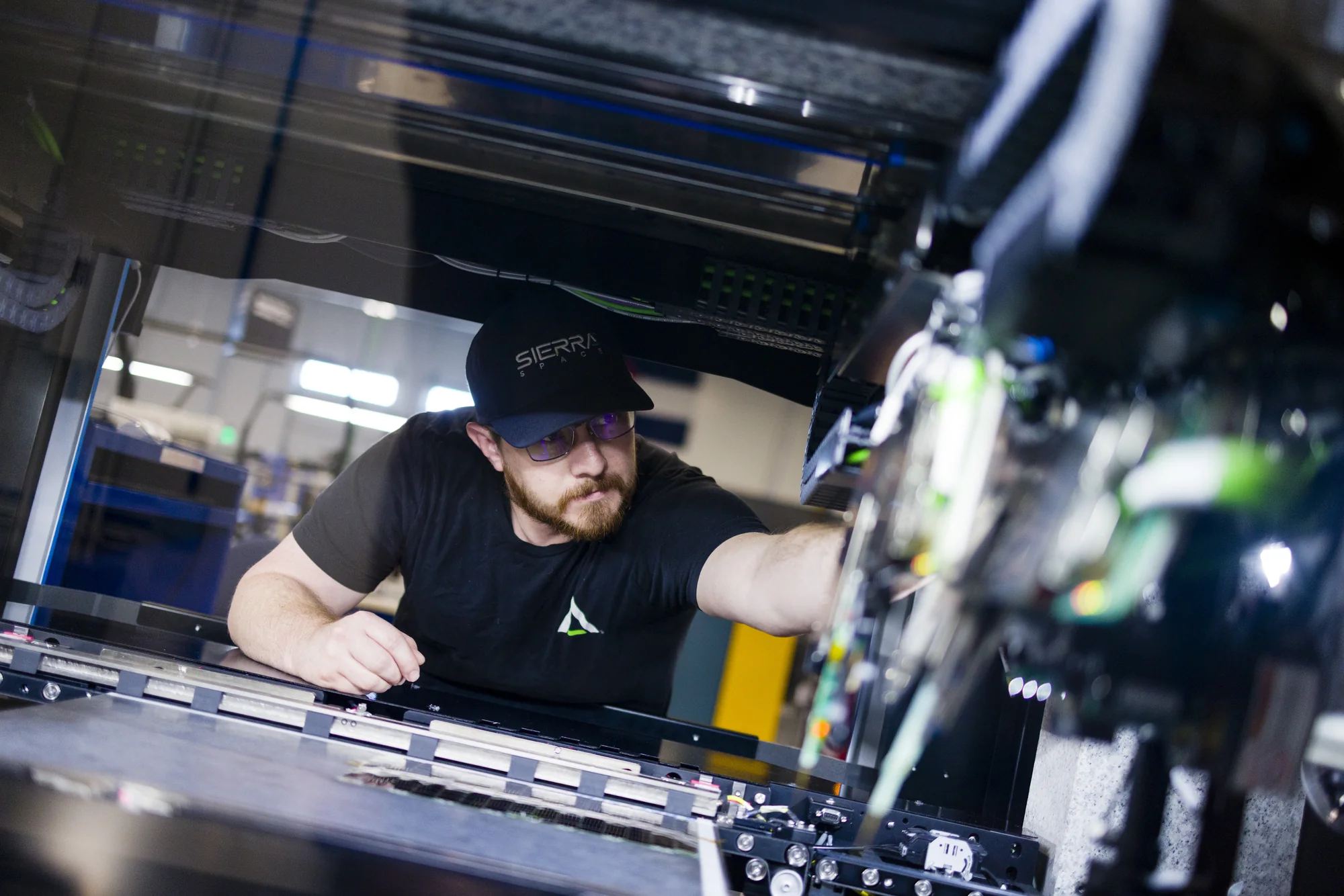 Sierra Space team member working on solar production equipment