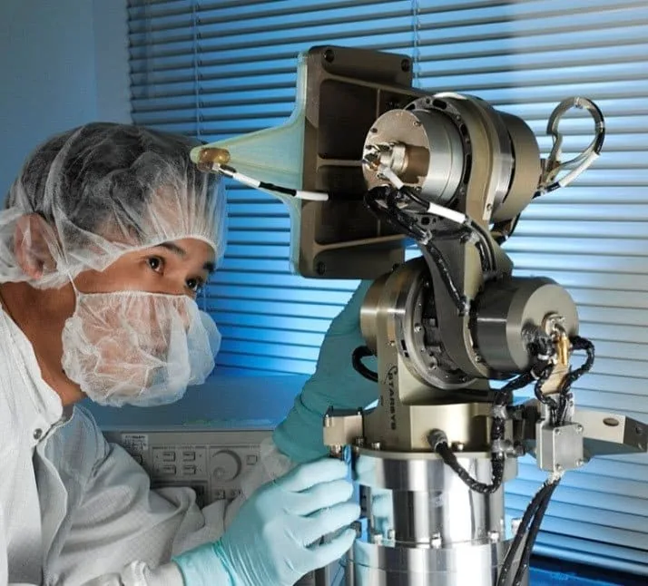 Technician working on Sierra Space LDC20 low-disturbance gimbal hardware